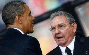 US President Obama greets Cuban President Castro at the memorial service for Nelson Mandela in Johannesburg